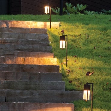 What are some retailers that offer colored landscape lighting?