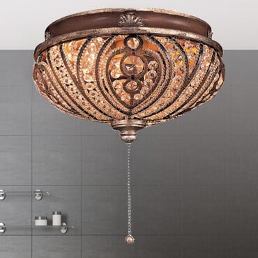 Pictured is a bronzed lighting kits with a pull chain and jewled cage.