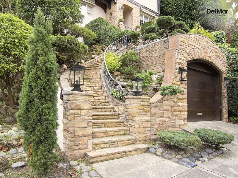 Image of stairs adorned with post lamps on short columns