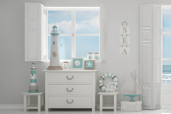 Pictured is a nautical style interior with whites, blues, and a coastal charm.