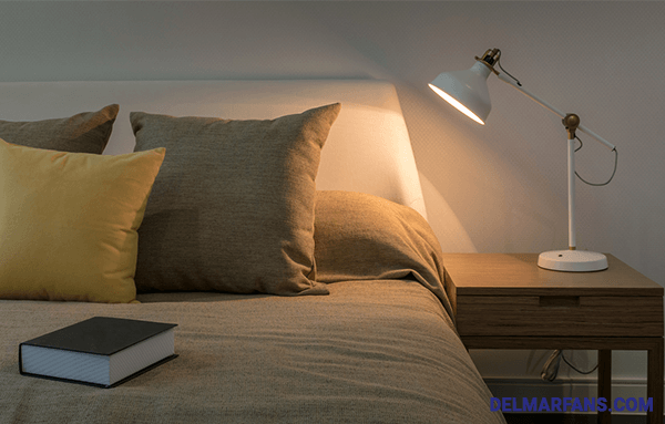 Adjustable Table Lamp On A Bedside Table