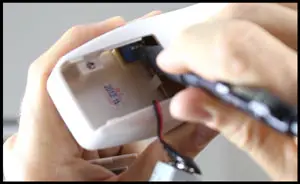 Showing How To Change The Frequency On The Ceiling Fan Remote