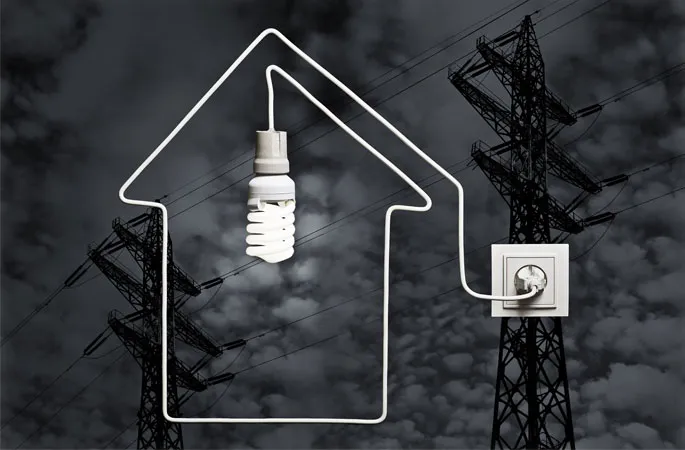 Light bulb With Important Electricity Energy Flowing Through A Cord In A House Shape